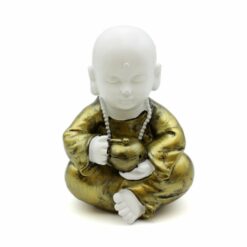 Sitting white baby monk with drum